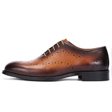 Brown leather dress shoe on a white