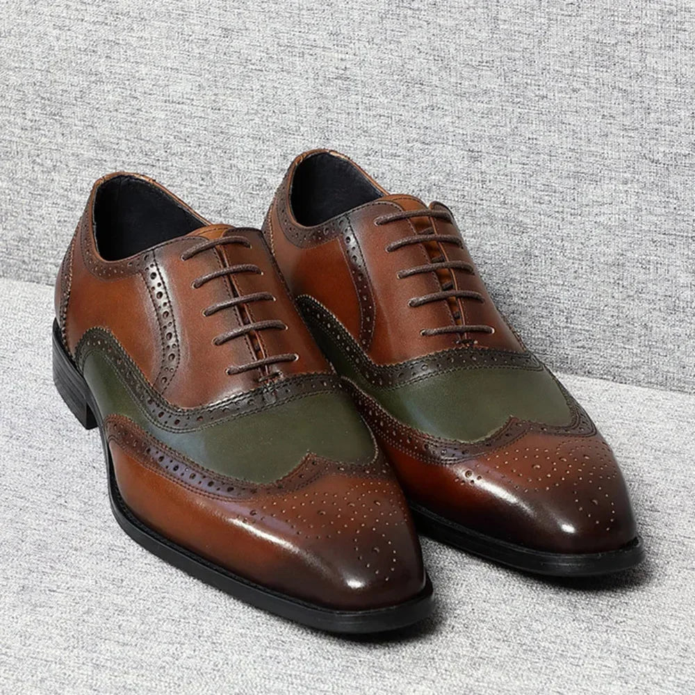 A pair of two-tone spectator leather Oxford shoes for men, with brown and green colors and brogue detailing.
