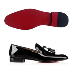 a pair of glossy black patent leather loafers with a red bottom sole and a tassel detail on the front. The loafers have a sleek silhouette and a signature red sole is visible.